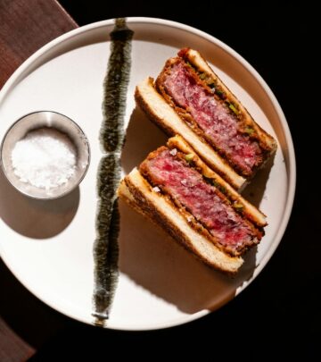 Experience the unforgettable blend of savory pork, ham, Swiss cheese, and pickles in Chef John’s iconic Cuban sandwich recipe.