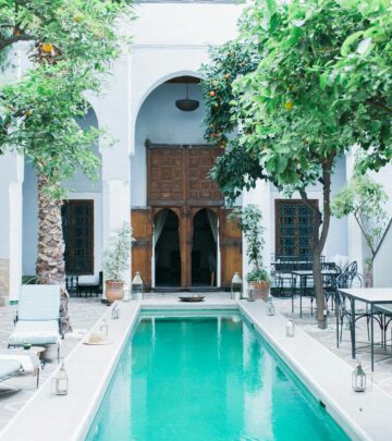 A serene outdoor retreat blends Mediterranean charm with eco-friendly design.