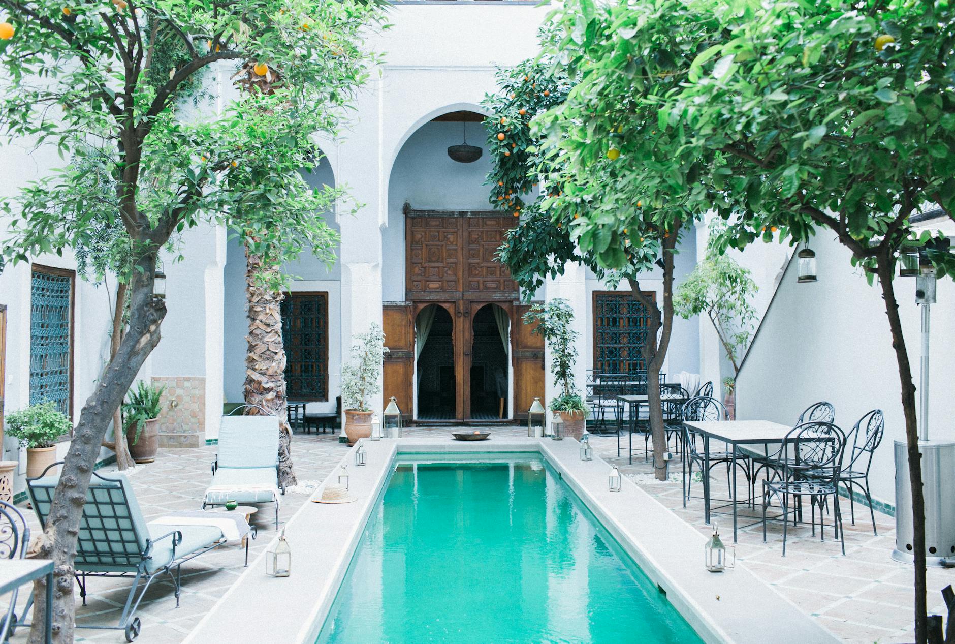 A serene outdoor retreat blends Mediterranean charm with eco-friendly design.