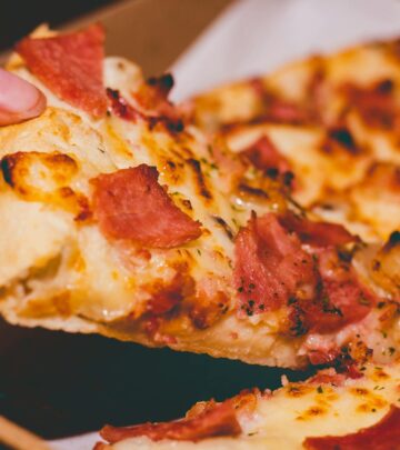 Tender slices glisten under a glossy glaze spiced by maple, orange, and ginger ale.